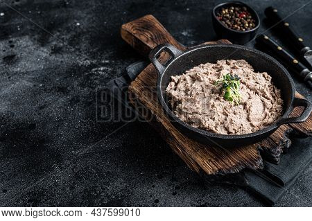 Duck Pate Rillettes De Canard In A Pan With Greens. Black Background. Top View. Copy Space