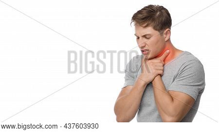 Desperate Young Caucasian Guy Suffer From Sore Throat, Pressing Hand To Throat, Highlighted In Red