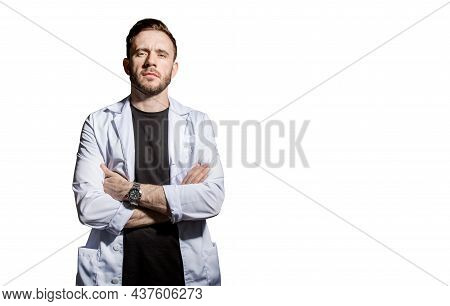 Doctor In A White Coat With A Magnifying Glass. Concept-search For Medicines, Vaccines, And Vaccinat