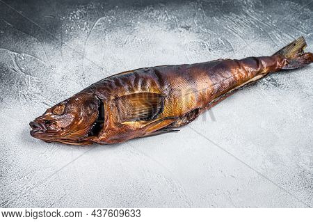 Hot Smoked Whole Fish On Kitchen Table. White Background. Top View