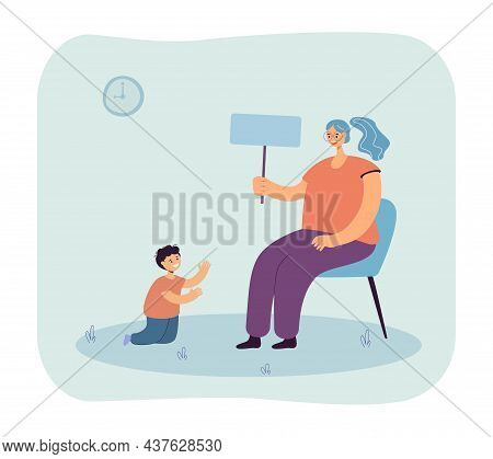 Young Kindergarten Teacher Sitting On Chair And Playing With Boy. Woman Teaching Child Via Game Flat
