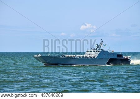 Large Modern Grey Warship Sailing In Still Blue Sea Water. Landing Craft Utility Lcu Conveying Landi