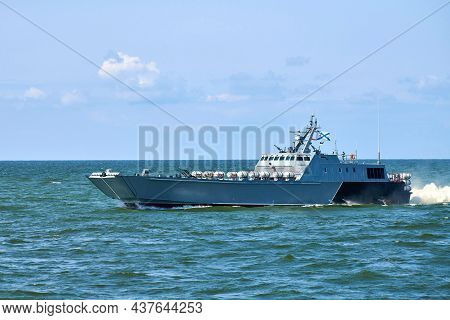 Large Modern Grey Warship Sailing In Still Blue Sea Water. Landing Craft Utility Lcu Conveying Landi