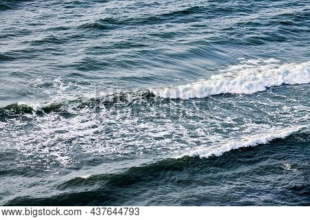 Deep Blue Sea Waters Splashing With Foamy Waves. Aerial View Of Ocean Splashing Waves, Dark Blue Wav