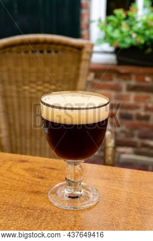 Glass Of Dark Tasty Belgian Dubbel Brown Beer From Abbey Brewery