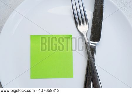 Intermitted Farsting Diet Concept - Empty Plate With Fork And Knife