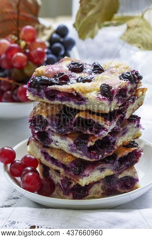 Traditional Italian Yeast Dough Pie With Grapes Schiacciata And Bunches Of Grapes On A Light Backgro
