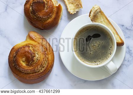 Cinnamon Rolls With Nut Filling, Served With Coffee.