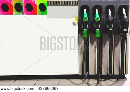 Petrol Dispensers Or Fuelling Nozzles At Gas Station. Close-up.copy Space.
