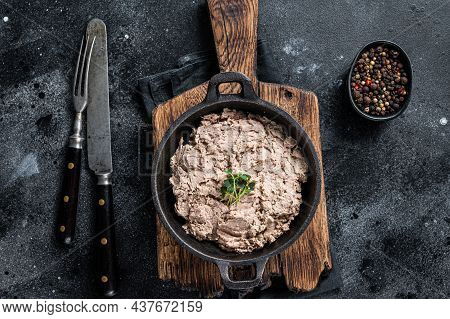 Duck Pate Rillettes De Canard In A Pan With Greens. Black Background. Top View