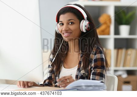 Portrait Of Pretty Young Office Worker In Headset, Making Notes, Search Information Online. Student 