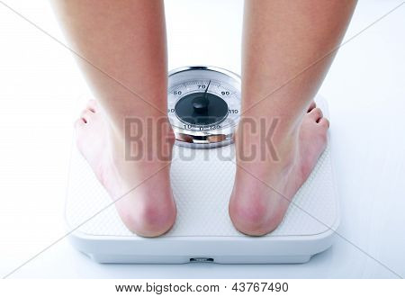 woman on a bathroom scale