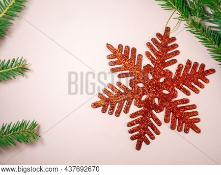 New Year Card. Christmas Card On A Pink Background. Decorations For The Holiday.
Red Snowflake