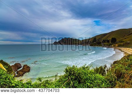 Scenic Cannibal Bay. Powerful ocean surf, white sand beach and blue-green water. Pacific coast of the South Island. New Zealand. TThe concept of ecological, active and photo tourism