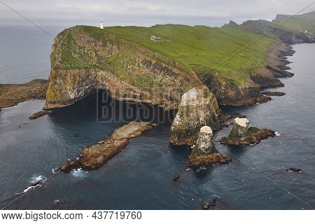 Mykines Lighthouse And Cliffs On Faroe Islands From Helicopter. Denmark