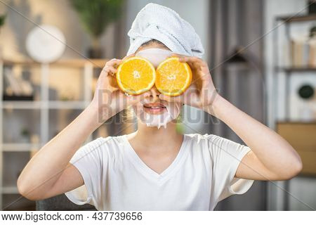 Close Up Portrait Of Pretty Female Teenger With Towel On Head And Mask On Face Covering Eyes With Sl