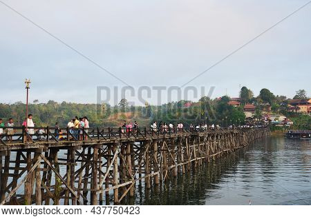 Thai People And Foreign Travelers Travel Walking Visit On Saphan Mon Or Uttamanusorn Longest Wooden