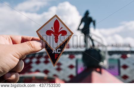 June 14, 2021, Florence, Italy. The Emblem Of The Football Club Acf Fiorentina Against The Backgroun