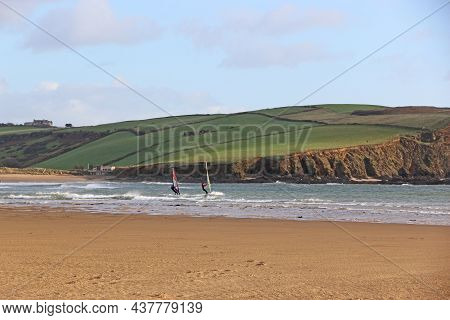 Windsurfers Off Bigbury Beach, Devon, At Low Tide
