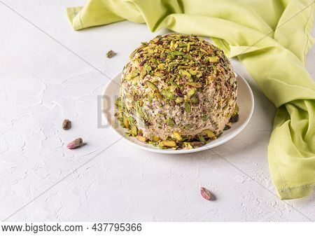 Ready To Eat Halva With Pistachios On Top, Few Scattered Nuts, Green Linen Napkin On Side. Turkish D