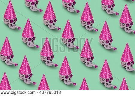 Pattern Of Human Skull  With A Pink Birthday Cap And Whistle On A Green Background. Minimal Holiday 
