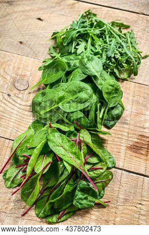 Mix Salad Leafs, Arugula, Spinach And Swiis Chard. Wooden Background. Top View