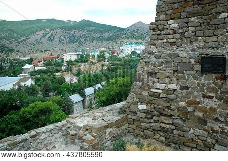 View Of Sudak From The Genoese Fortress. Rocky Mountains, City View From The Mountain. Sudak, Crimea
