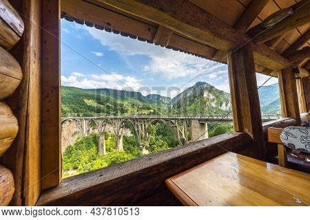 View Of Tara Canyon Bridge Through Log Cabin Window,durmitor National Park,montenegro.