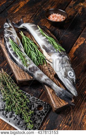Whole Fresh Raw Icefish On A Wooden Cutting Board. Wooden Background. Top View