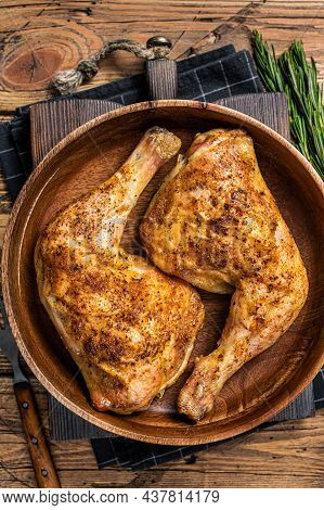 Bbq Grilled Chicken Legs In A Wooden Plate With Herbs. Wooden Background. Top View