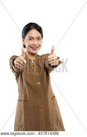 Confident Civil Woman Wearing Uniform Standing With Two Thumbs Up To Camera