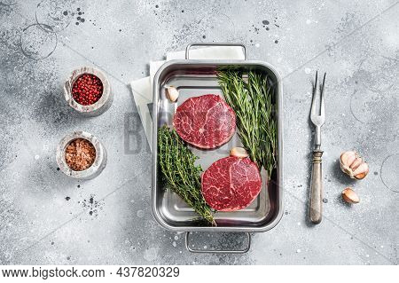 Raw Fillet Mignon Beef Steaks From Tenderloin. Gray Background. Top View
