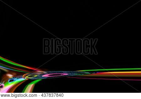 Colorful Reflections Of Lights On A Black Background