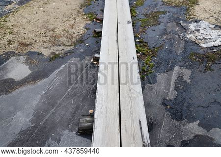 Old Wooden Walkway Made Of Thin Long Boards