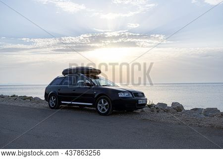 Zarar, Croatia - July 28, 2021: Travelers Car Audi A6 On The Seashore In The Evening.