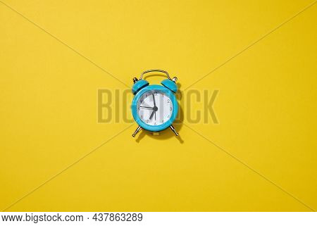 Round White Alarm Clock On The Table. Time Seven In The Morning, Get Up Early, Change Hours