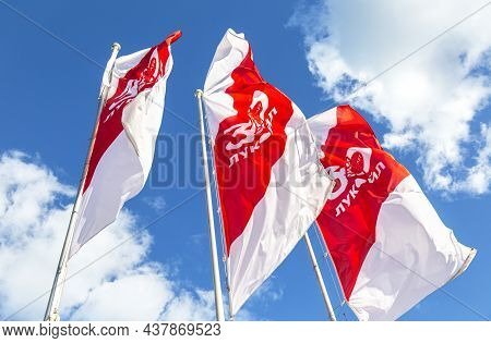 Mordovia, Russia - July 5, 2021: Flags Of The Oil Company Lukoil Against The Blue Sky. Lukoil Is One