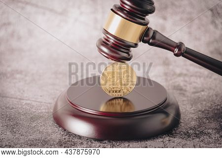 Representative Cryptocurrency Under The Judges Gavel In The Foreground.