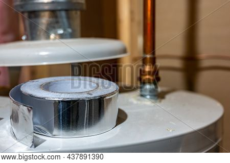 Selective Focus On The Edge Of A Roll Of Metallic Aluminum Foil Hvac Duct Tape