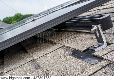 Rail, Bracket, And Anchor To A Solar Panel Installed On A Asphalt Shingle Roof