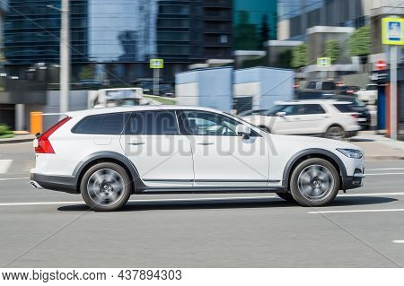 Volvo V90 Cross Country Moving On City Road. Driver In White Estate Car Rushes For Job. Moscow, Russ