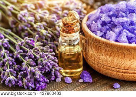 Lavender's Spa Products With Dried Lavender Flowers On A Wooden Table. Flat Lay Bath Salt And Massag