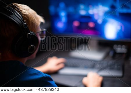 Caucasian Young Teen Guy Plays Games On Computer And Streams The Games Live. Participates in the eSports Tournament