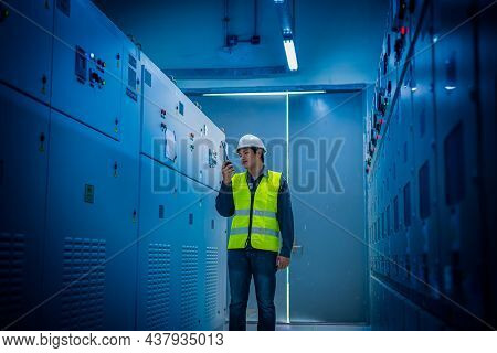 Engineer Checking And Inspecting At Mdb Panel .he Working With Electric Switchboard To Check Range O