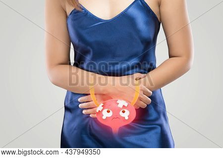 Cystitis Symptoms With Woman On A Gray Background