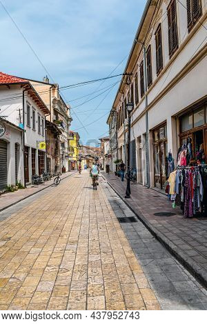 Shkoder, Albania - June 21, 2021: Tourist Pedestrian Rruga G'juhadol Street In Shkodra. Cyclists Are
