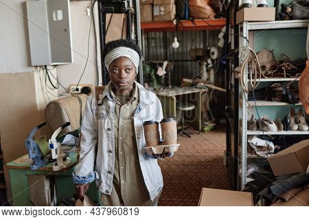 African Young Woman Having A Break At Her Work She Carrying Lunch Box And Coffee Drinks