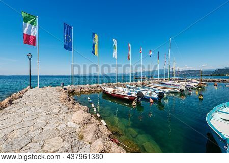 Lake Garda (lago Di Garda), Small Port With Many Boats Moored. Cisano Village, Tourist Resort In Ver
