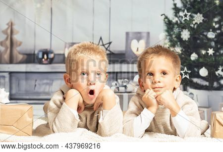 Twin Boys Lying At Home At Christmas Parties