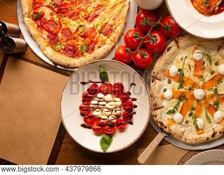 Top Down View On Enormous Buffet Of Delicious Freshly Prepared European Cuisine And Pizza With Empty